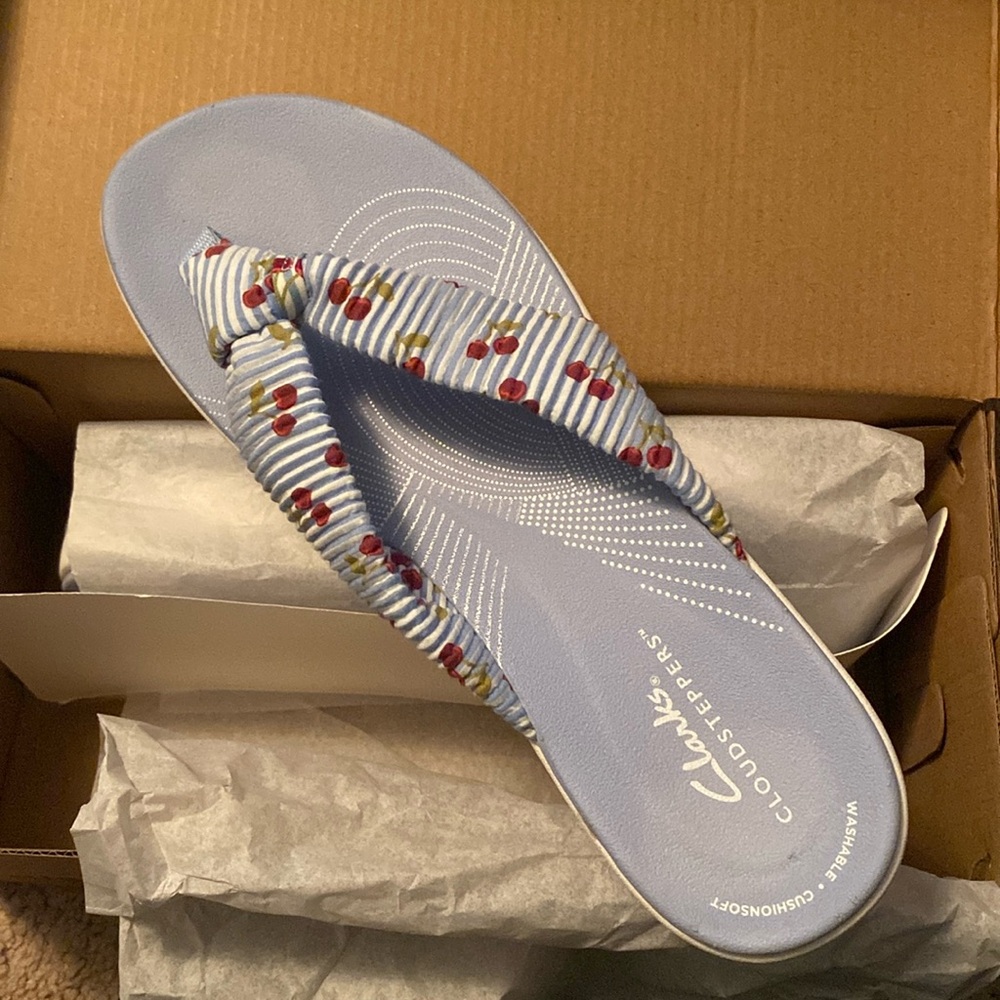 Clarks pale blue strip and rose design, flip flops size 9